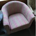 A contemporary tub chair, upholstered in a pink striped fabric