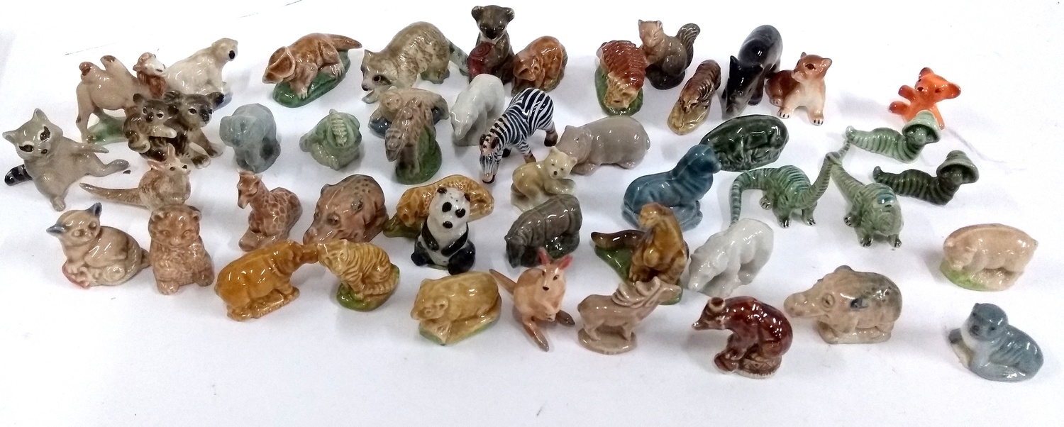 A collection of Wade and other whimsies, mainly exotic animals and dinosaurs to include a