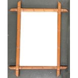 A bamboo framed wall mirror, external dimensions 76x58cm