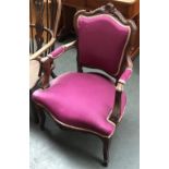 A purple upholstered continental open armchair with serpentine front