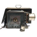 An early electric slide projector, with bulb, in black metal case