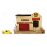 A Triang wooden model 'Minic Service Station', with lifting garage door and sliding compartment,