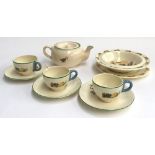 A Wacol England children's tea service comprising of teapot, three cups and three saucers with