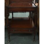 A mahogany whatnot, with undershelf and drawer, on brass casters, 46cm square