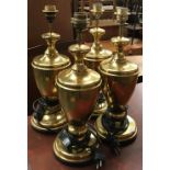 A set of four gilt metal table lamps, 46cmH