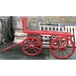A 19th century funeral bier, painted red, 170cmL