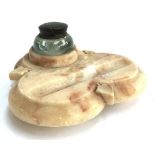 A marble Art Nouveau inkwell, clover shaped with carved ivy leaf decorations