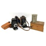 A Kodak Junior II bellows camera with Dakon II shutter, in leather case; a Kodak 'Brownie' Dakon