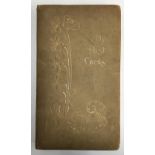 An early 20th century cloth bound post card album, the cover embossed with floral design, filled