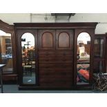 A very large 19th century mahogany gent's wardrobe, in three parts, the central section comprising