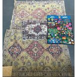 Two yellow rugs, one other, and a Colombian patchwork