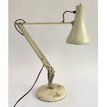 A white anglepoise lamp