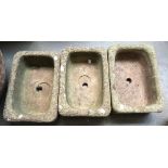 Three composite stone rectangular planters, each 38x27cm