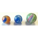 Three 19th century onion skin marbles (af), orange and blue swirls, 26mmD; blue and white swirls,