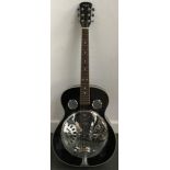 A Martin Smith resonator guitar (black with single cone resonator)