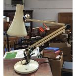 A white anglepoise lamp