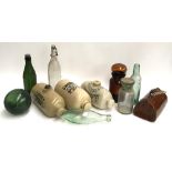 A mixed lot to include four stoneware hot water bottles, chemist's jars, and several vintage glass