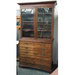 A late 19th century glazed secretaire bookcase, dentil frieze over three shelves, fitted