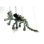 A Pelham Puppet 'Mother Dragon', wooden body with felt wings; together with 'Baby Dragon', wooden