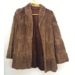 A rabbit fur jacket; together with a beaver lamb fur coat (2)