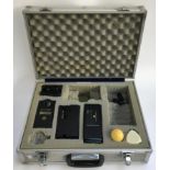 A surveyors kit in aluminium case, to include sonic tape, damp meter, binoculars, range meter
