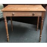 A pine side table, single drawer on turned legs