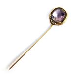 Gold stick pin (hallmarked rubbed), set with cut amethyst, gross weight 3.4g