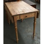 A pine dropleaf table, single end drawer, on turned legs, 98cmW