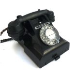 A black bakelite rotary dial telephone, GPO 312L S58/3A (adapted)