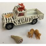 A vintage Corgi ltd 'Lions of Longleat' land rover, together with two lions and a leg of meat