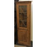 A pine cabinet with astragal glazing over cupboard door, 190cmH