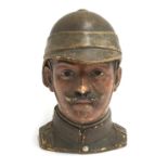 A 19th century Bernard Bloch pottery tobacco jar and cover, modelled as a British officer of the