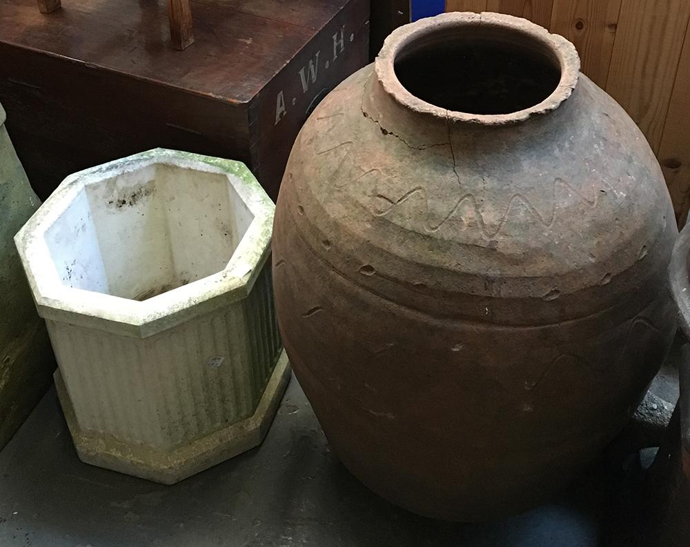 A composite stone planter together with a large terracotta urn (af), 65cmH