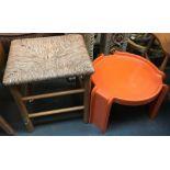 A pine bathroom stool with rush seat, and a 1970s orange occasional table by Kartell, the designer