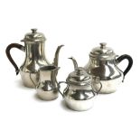 A 'Les Etains de Paris' pewter teapot and coffee pot each with hardwood handle, milk jug and
