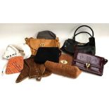A quantity of ladies leather handbags to include Marc Jacobs, Mulberry, a bead bag, etc, and a