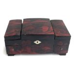 A lacquered Japanned musical jewellery box, having five compartments lined with pink corduroy fabric
