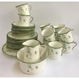 A Blair china green and white part tea set to include tea cups, saucers, plates, milk jug, sugar