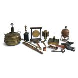 A mixed lot of copper and brass items to include: horse brasses; stirrups; square brass candle