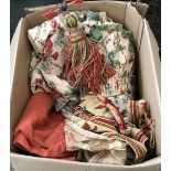 A box of various curtains and fabrics