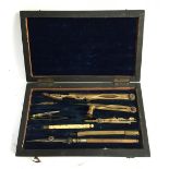 A mid-19th century brass and ivory geometry set in fitted rosewood case with blue velvet interior