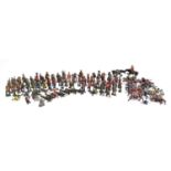 A large collection of approx. 100 cast metal toy soldiers, cowboys and Indians, mainly Britains ltd