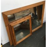 Two pine framed wall mirrors, the larger 105x73cm