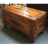 A carved camphor wood chest, 69cmW