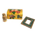 A hinged wooden box with hand painted floral design; together with a Russian doll and a small mirror