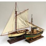 A wooden model of a yacht with rigging, LOA 51cm together with a wooden model of a fishing trawler