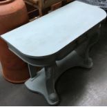 A painted Victorian side table, single drawer, on scrolling carved cabriole supports and undershelf,