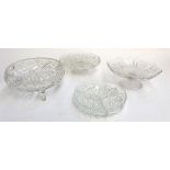 A cut glass fruit bowl, cut glass hors d'oeuvre dish, and two stemmed glass cake stands