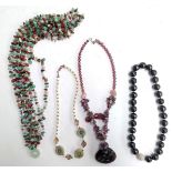 Four beaded and quartz necklaces
