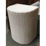 A Lloyd Loom white painted wicker laundry basket, bears label